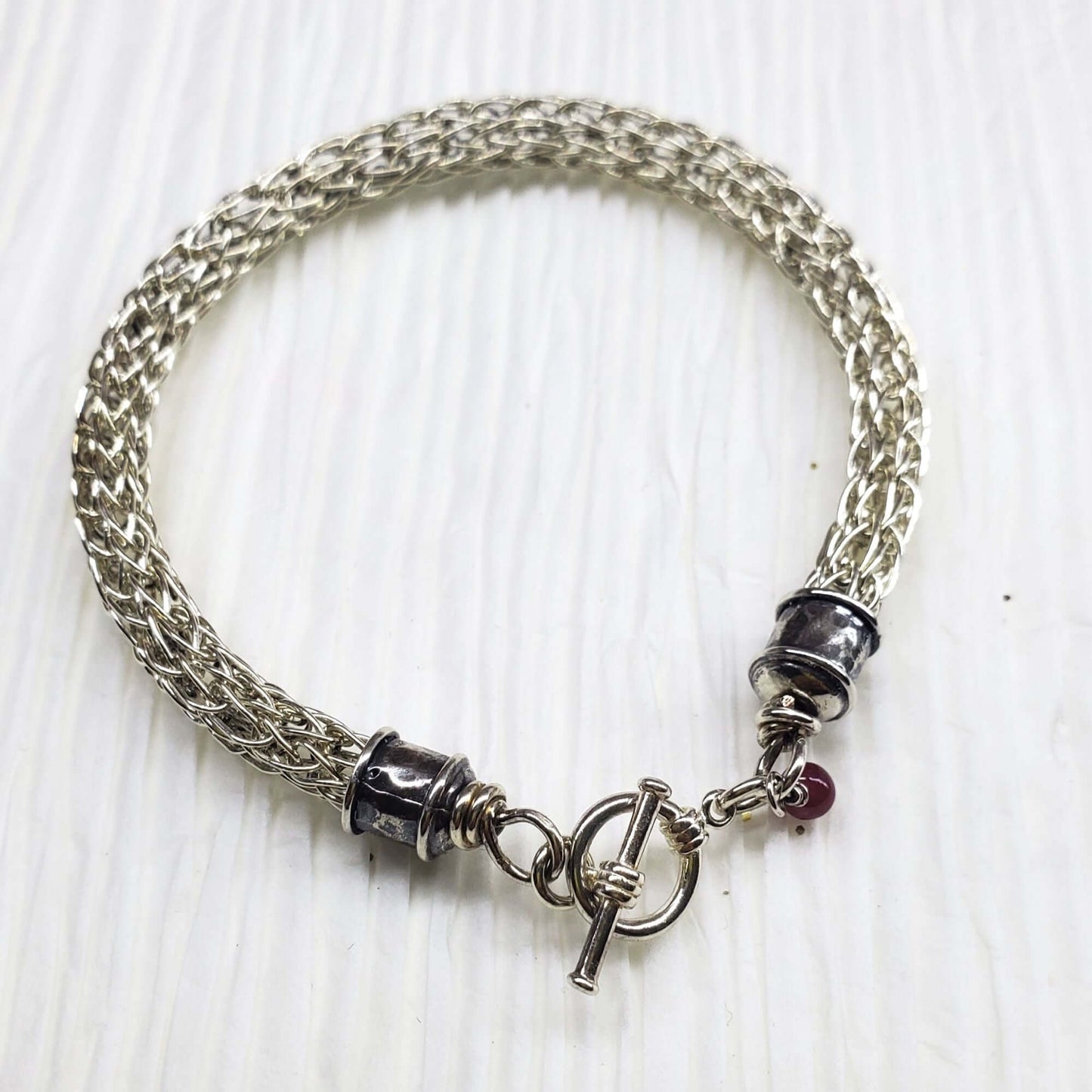 Handmade 10mm silver Viking knit bracelet with Ruby charm