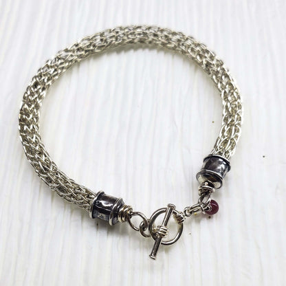 Handmade 10mm silver Viking knit bracelet with Ruby charm