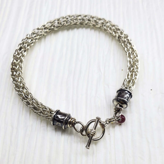 Handmade 10mm silver Viking knit bracelet with Ruby charm