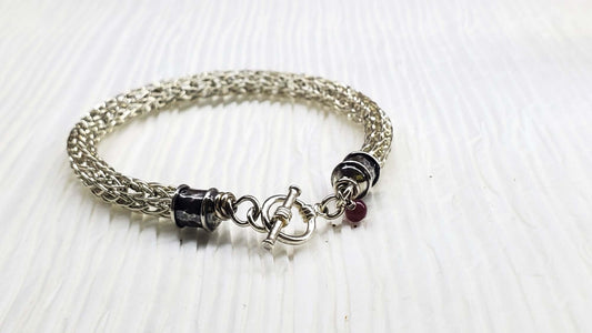 Handmade 10mm silver Viking knit bracelet with Ruby charm