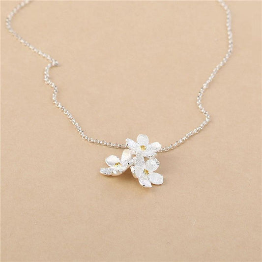 triangle forget me not necklace